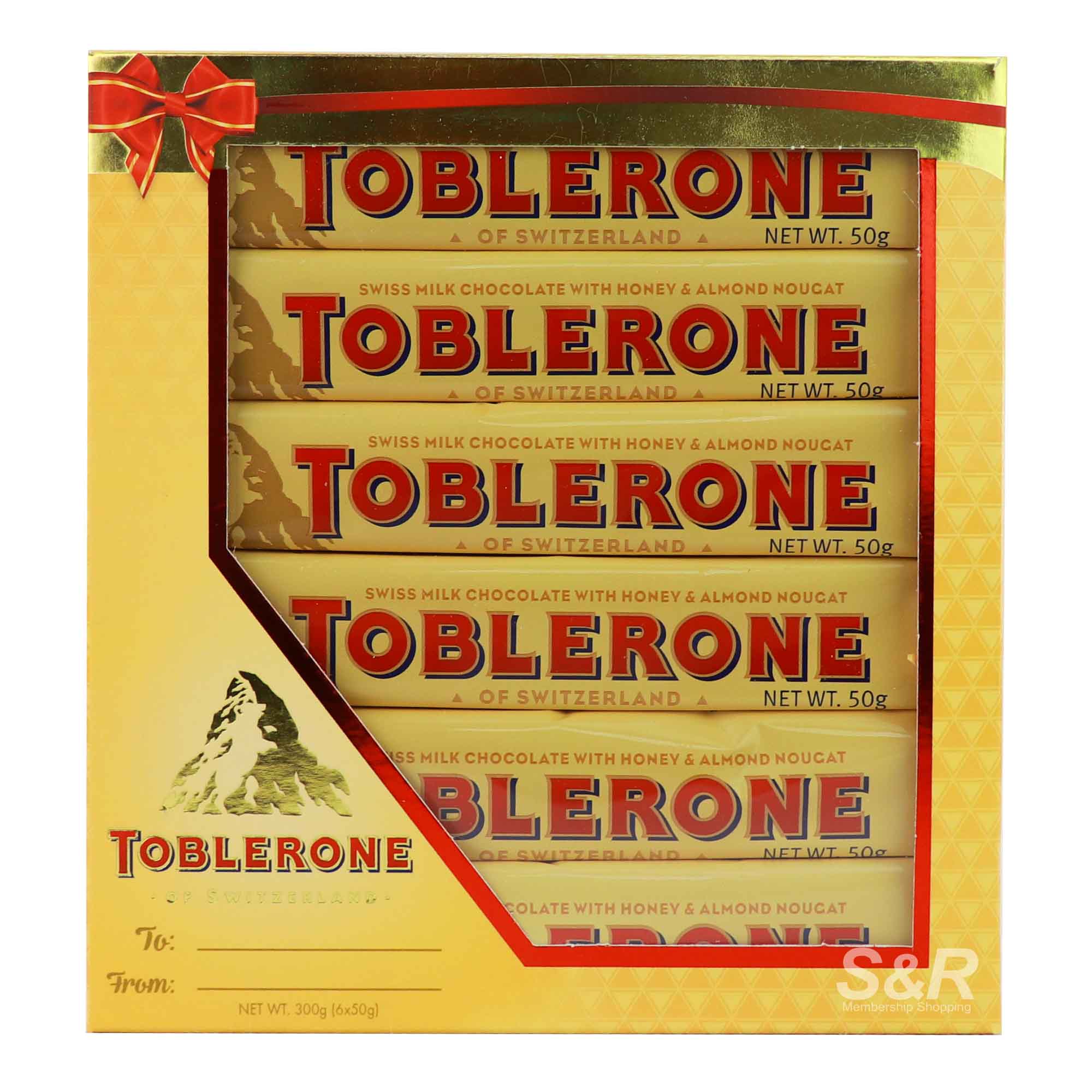 Toblerone Swiss Milk Chocolate with Honey and Almond Nougat 6pcs Toblerone Swiss Milk Chocolate with Honey and Almond Nougat 6pcs
